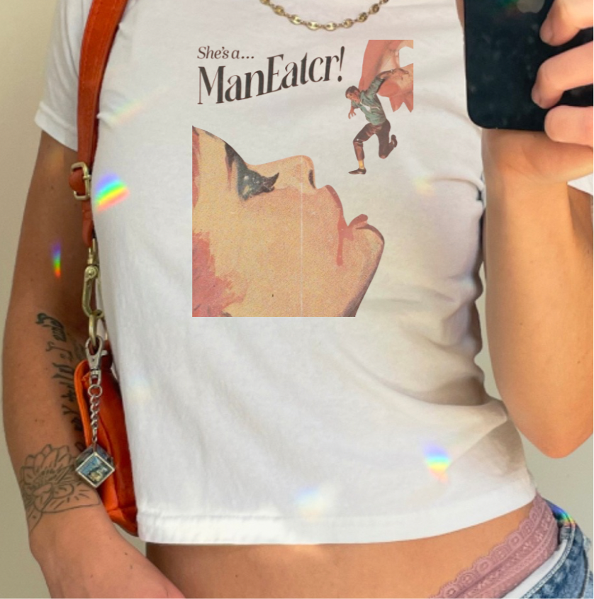SHE’S A MAN EATER BABY TEE